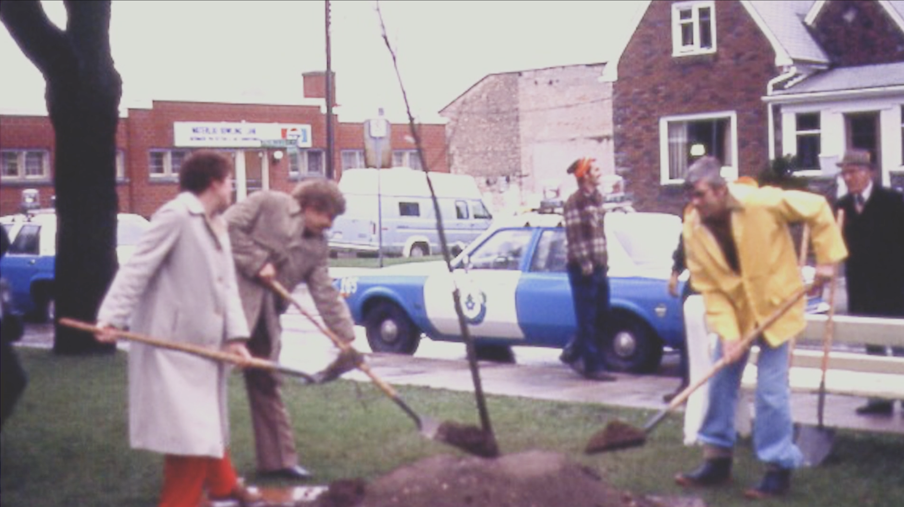 4 people digging in the 1970s